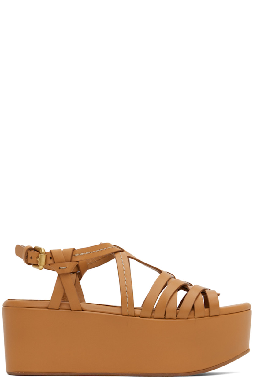 Buffed leather heeled sandals in tan.

· Open toe
· Criss-crossing straps at vamp
· Pin-buckle ankle strap
· Logo embossed at padded footbed
· Covered platform midsole
· Rubber outsole
· Platform: H2.5 in

Supplier color: Tan/Pastel brown