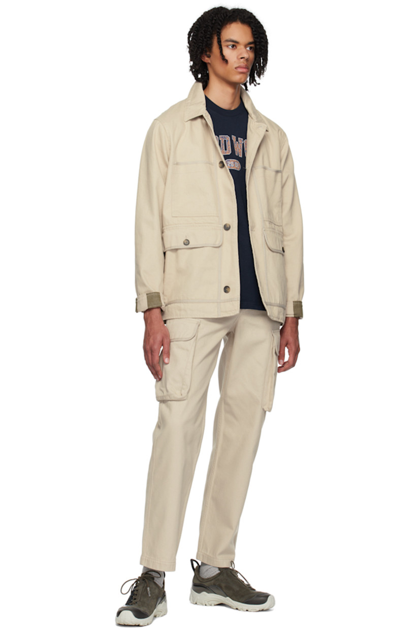 Cotton twill jacket. 

· Spread collar 
· Button closure 
· Welt and flap pockets 
· Logo flag at side seam
· Single-button barrel cuffs 
· Stripes at back hem 
· Patch pockets at interior 
· Partial plain-woven cotton lining 

Supplier color: Warm grey