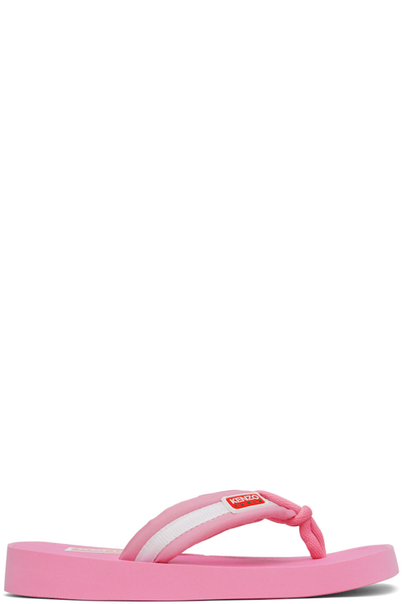 Nylon twill and webbing flip flops in pink. Rubberized logo patch at padded thong-style strap.

· Open square toe 
· Logo bonded at textured molded rubber footbed 
· Treaded rubber sole

Supplier color: Pink