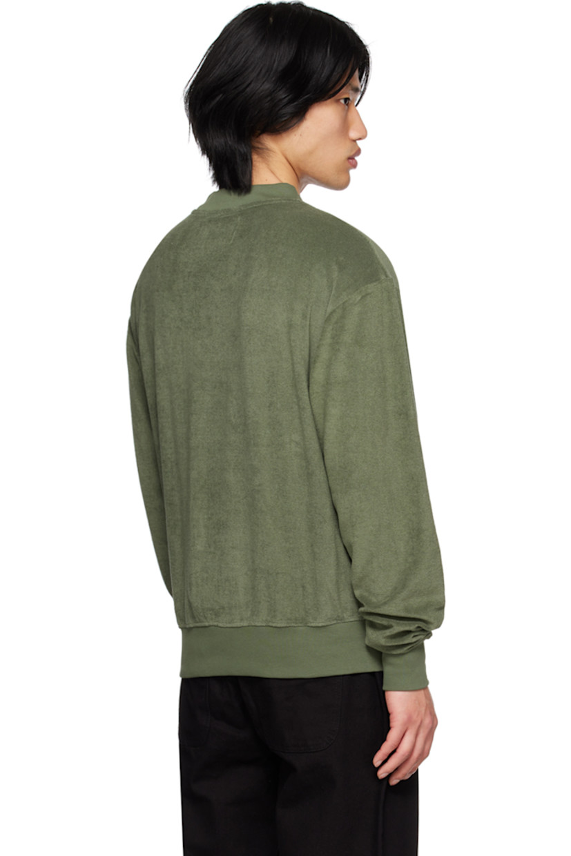 Cotton terrycloth sweatshirt.

· Rib knit crewneck, hem, and cuffs
· Felted logo patch at chest 

Supplier color: Green