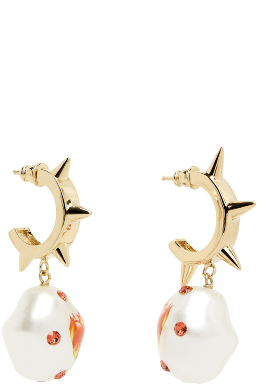 Pair of open hoop earrings in 24k gold-plated brass. Faux-pearl with graphic and Swarovski crystals in red at drop.

· Studded detailing at face
· Post-stud fastening
· H2" x W1"

Supplier color: Gold