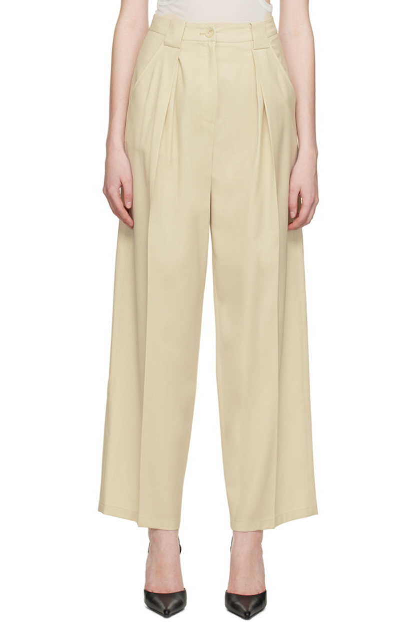 Wide-leg stretch wool trousers.

· Belt loops
· Four-pocket styling
· Zip-fly
· Pleats at front
· Central creases at front and back

Supplier color: Beige