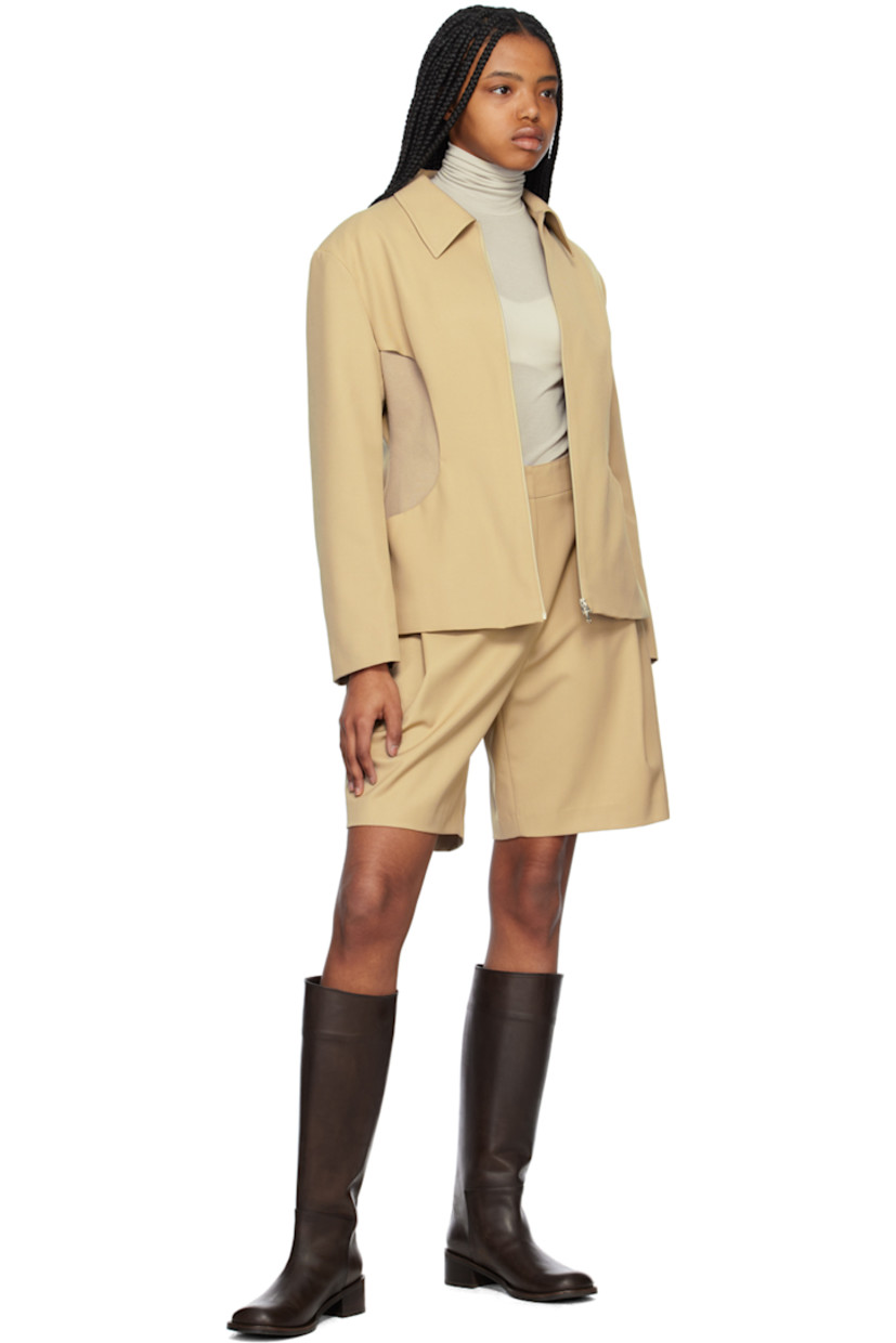 Wool-blend twill shorts.

· Partially elasticized waistband
· Four-pocket styling
· Zip-fly
· Pleats at front

Supplier color: Beige