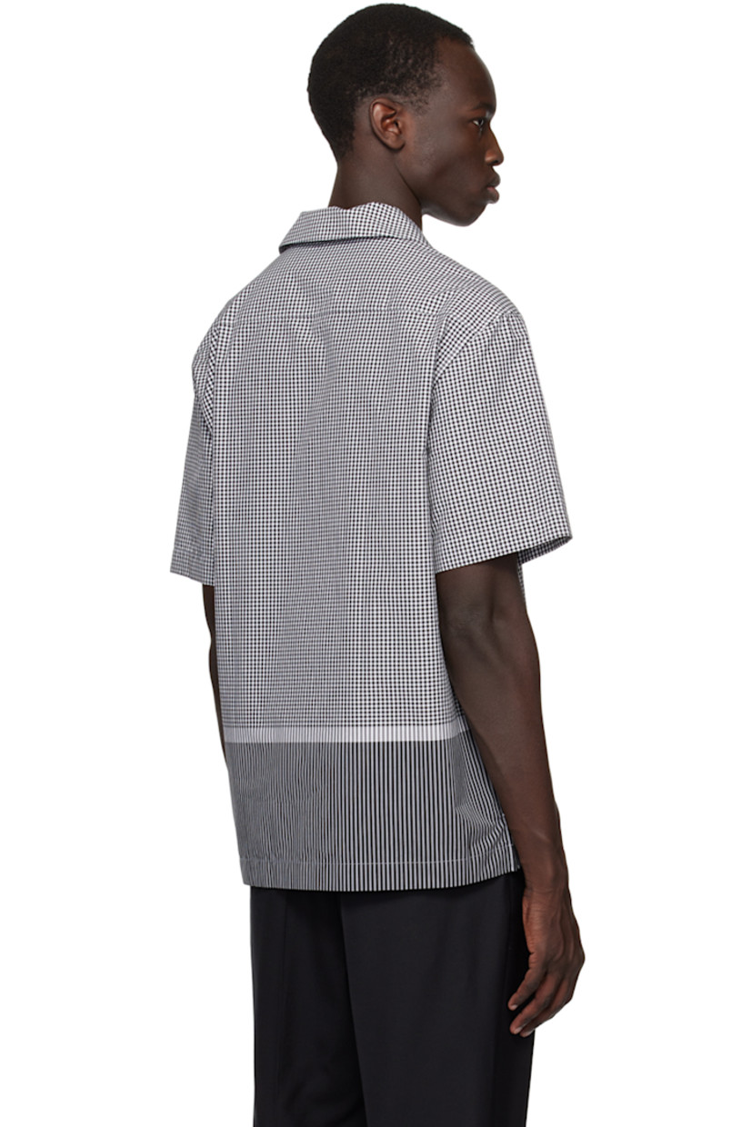 Cotton poplin shirt. Check and stripe pattern throughout.

· Open spread collar
· Button closure
· Vented side seams 
· Logo hardware at side seam
· Mother-of-pearl hardware

Supplier color: Black/White