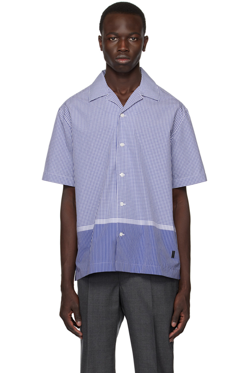Cotton poplin shirt. Check and stripe pattern throughout.

· Open spread collar
· Button closure
· Vented side seams 
· Logo hardware at side seam
· Mother-of-pearl hardware

Supplier color: Blue/White