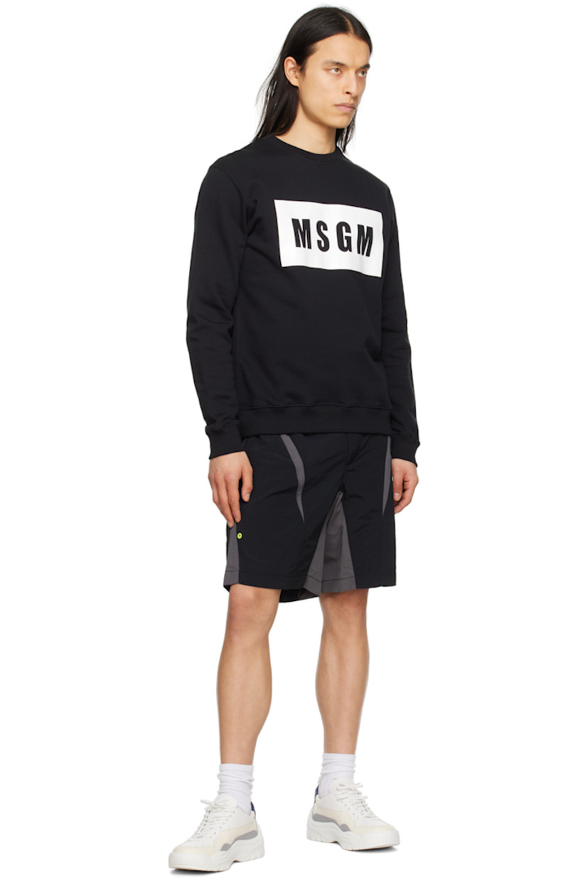 Nylon canvas shorts.

· Paneled construction
· Integrated cinch belt at elasticized waistband
· Belt loop at waistband
· Logo flag at waistband
· Two-pocket styling
· Zip-fly
· Eyelet vent at leg

Supplier color: Black