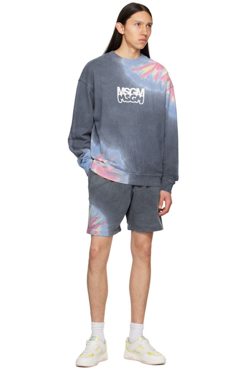 French terry shorts. Tie-dyed pattern printed throughout. 

· Drawstring at elasticized waistband
· Three-pocket styling
· Logo printed at front

Supplier color: Multicolor