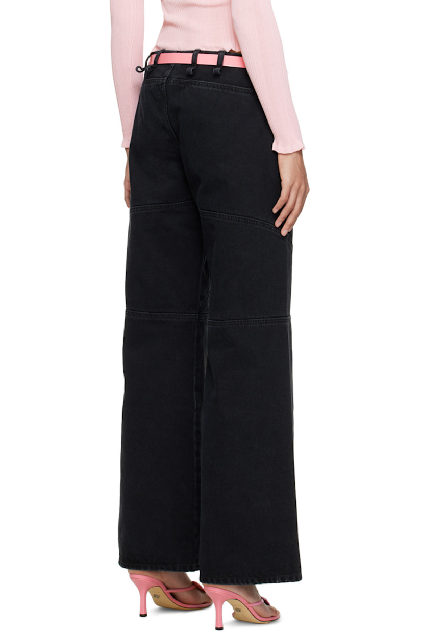 Non-stretch denim jeans. Fading throughout. 

· High-rise 
· Belt loops 
· Three-pocket styling 
· Button-fly 
· Darts at front and back 
· Flared cuffs 

Supplier color: Black