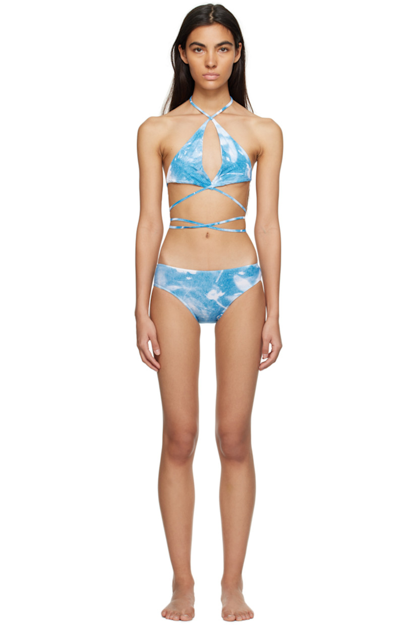 Stretch nylon jersey bikini top. Graphic pattern printed throughout. 

· Halter neck 
· Keyhole cutout at chest 
· Criss-crossing straps at back 
· Fully lined

Stretch nylon jersey bikini bottoms. Graphic pattern printed throughout. 

· Elasticized waistband 
· Unlined 

Supplier color: Blue/White