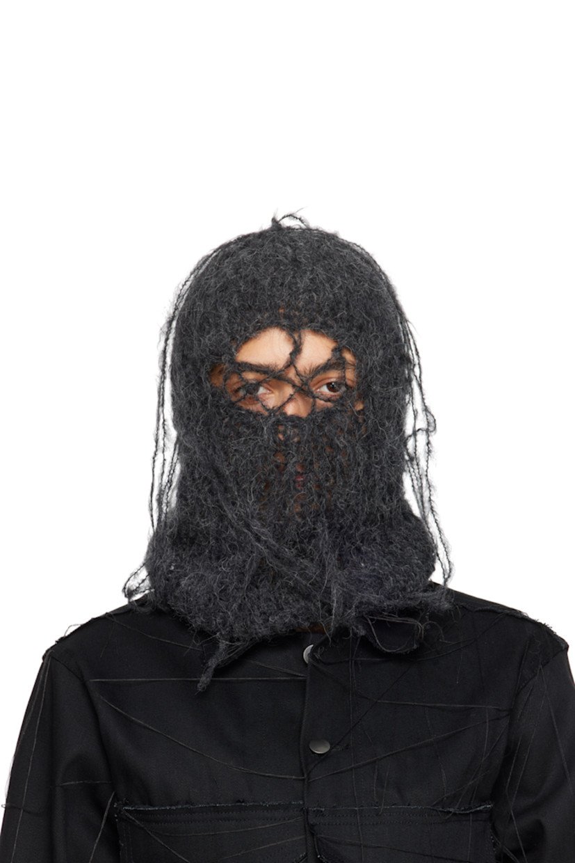 Hand-open knit alpaca-blend balaclava in gray. Loose thread detailing throughout.

This item is part of a limited run of 25.

Each item is unique. Please note that finishings may vary.

Face masks and face coverings are final sale and are not eligible for return or exchange.

Supplier color: Onyx