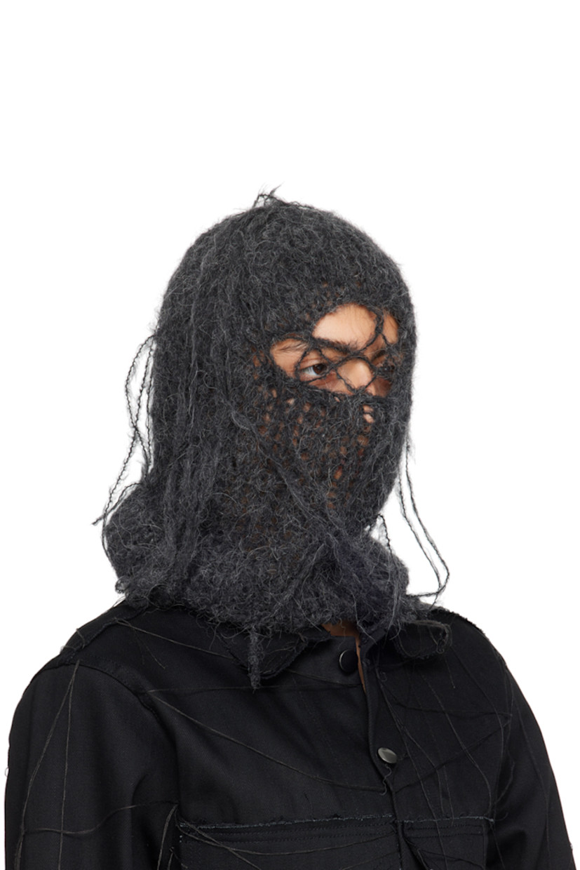 Hand-open knit alpaca-blend balaclava in gray. Loose thread detailing throughout.

This item is part of a limited run of 25.

Each item is unique. Please note that finishings may vary.

Face masks and face coverings are final sale and are not eligible for return or exchange.

Supplier color: Onyx