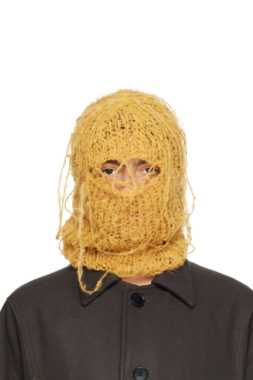 Hand-open knit alpaca-blend balaclava in yellow. Loose thread detailing throughout.

This item is part of a limited run of 30.

Each item is unique. Please note that finishings may vary.

Face masks and face coverings are final sale and are not eligible for return or exchange.

Supplier color: Saffron