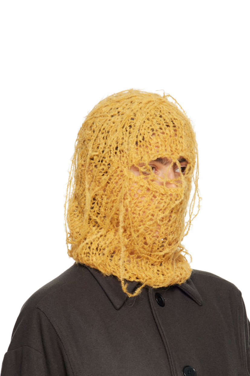 Hand-open knit alpaca-blend balaclava in yellow. Loose thread detailing throughout.

This item is part of a limited run of 30.

Each item is unique. Please note that finishings may vary.

Face masks and face coverings are final sale and are not eligible for return or exchange.

Supplier color: Saffron