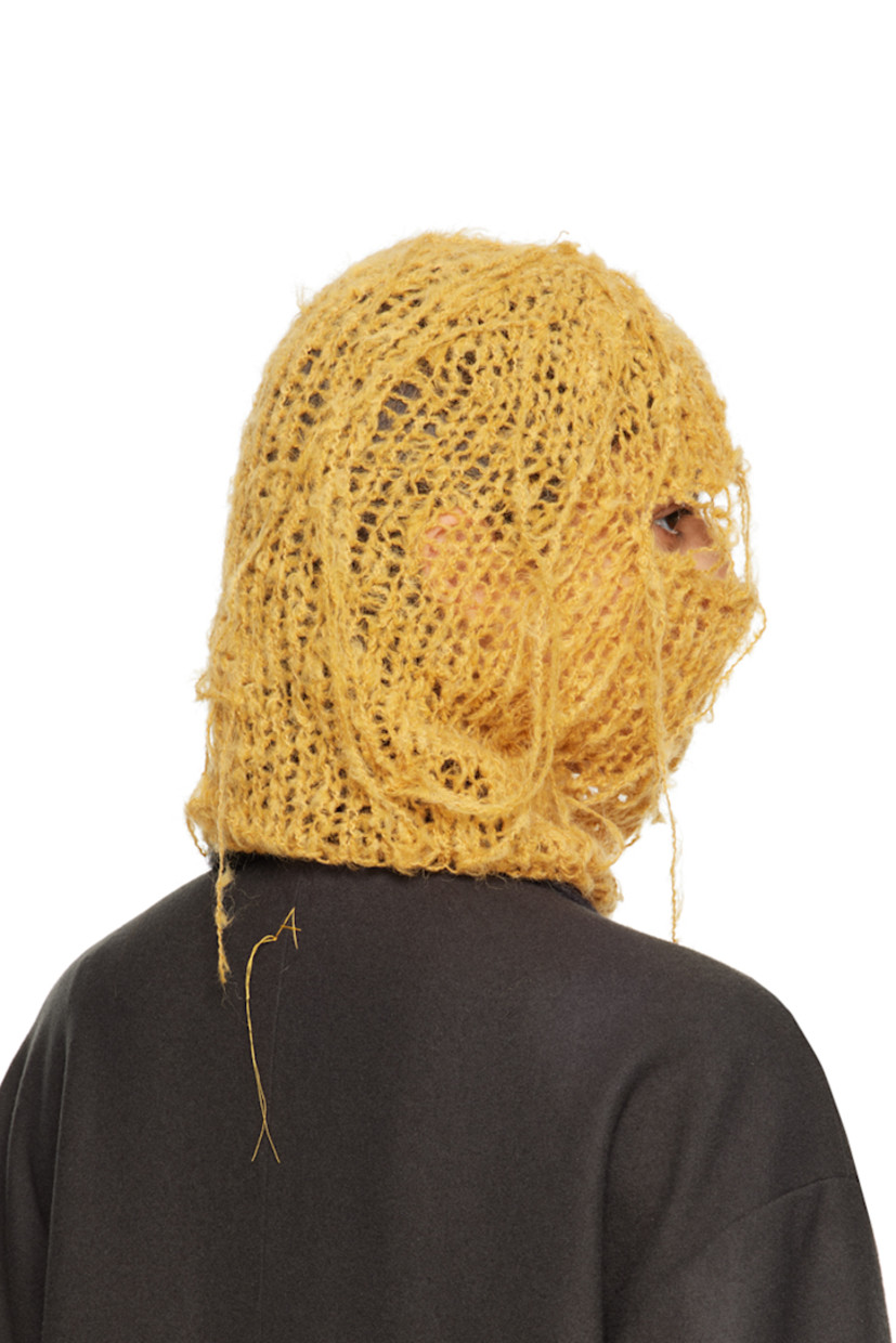 Hand-open knit alpaca-blend balaclava in yellow. Loose thread detailing throughout.

This item is part of a limited run of 30.

Each item is unique. Please note that finishings may vary.

Face masks and face coverings are final sale and are not eligible for return or exchange.

Supplier color: Saffron