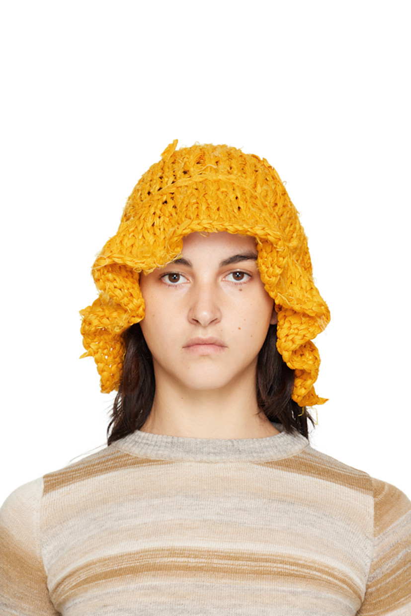 Hand-knit silk bucket hat in yellow. 

· Distressing and loose thread detailing throughout
· Unlined

Each item is unique. Please note that finishings may vary.

Supplier color: Saffron