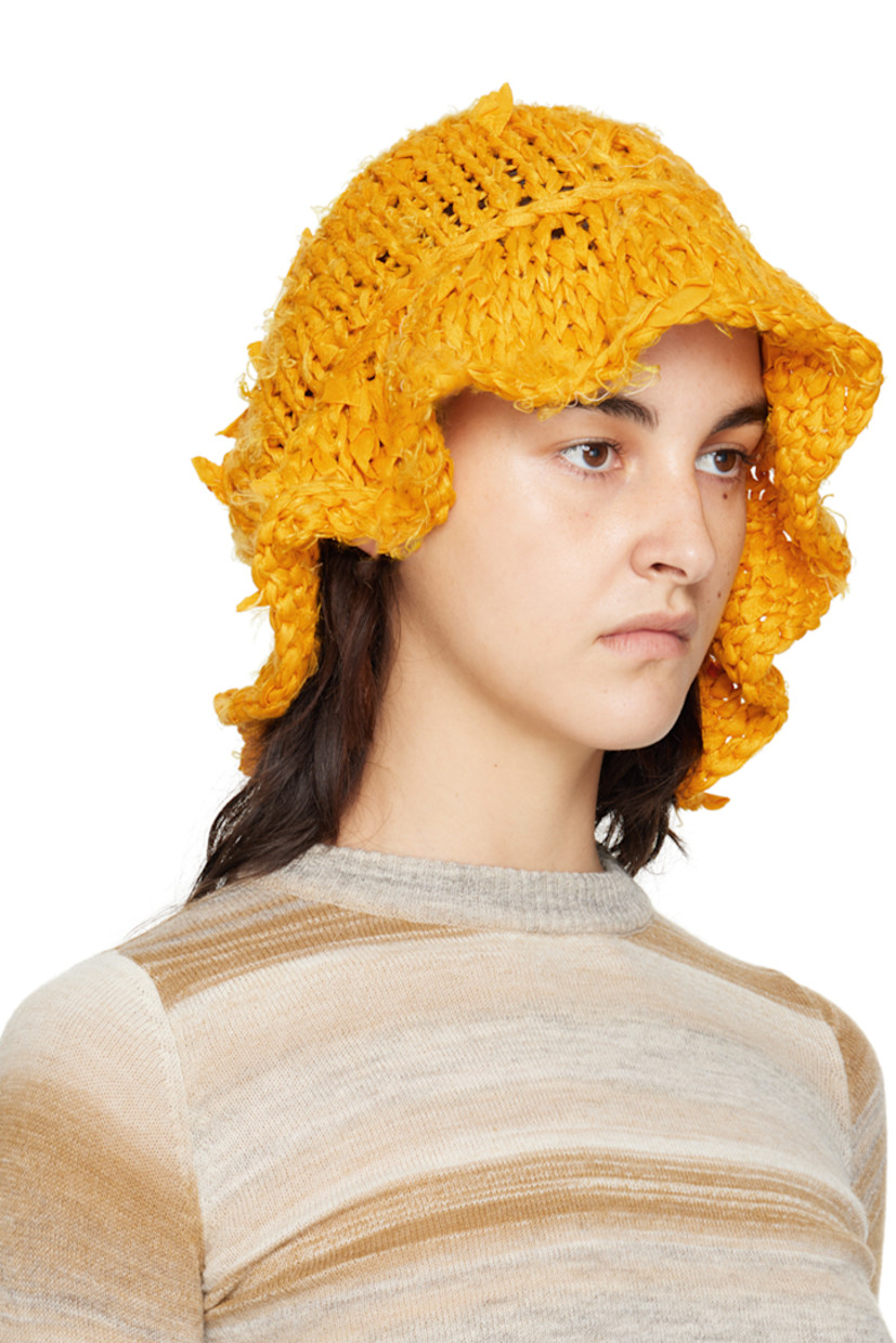 Hand-knit silk bucket hat in yellow. 

· Distressing and loose thread detailing throughout
· Unlined

Each item is unique. Please note that finishings may vary.

Supplier color: Saffron