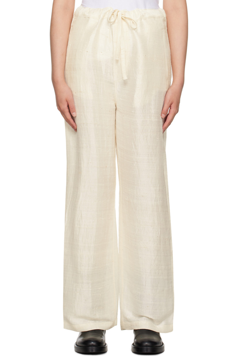 Silk khadi trousers.

· Self-tie drawstring at waistband
· Four-pocket styling
· Button-fly
· Logo embroidered at back
· Unlined

Supplier color: Natural