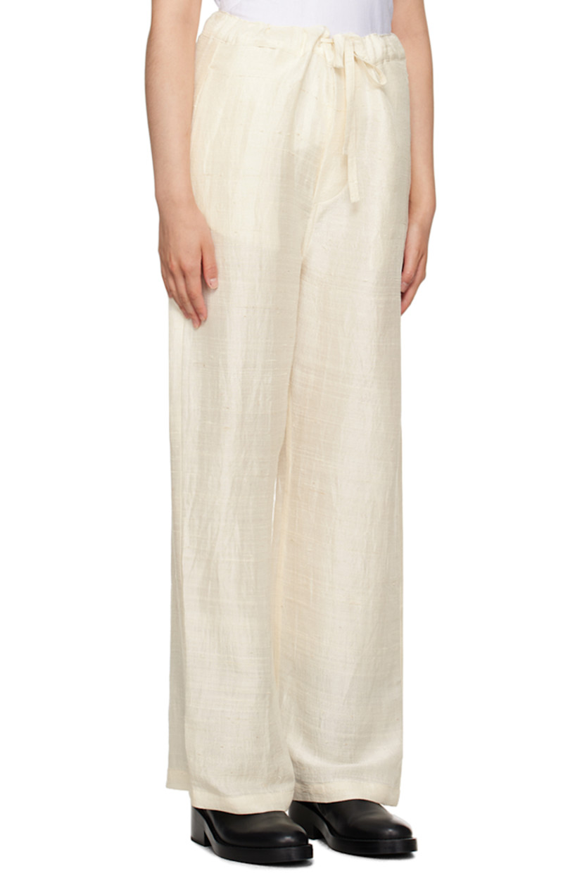 Silk khadi trousers.

· Self-tie drawstring at waistband
· Four-pocket styling
· Button-fly
· Logo embroidered at back
· Unlined

Supplier color: Natural