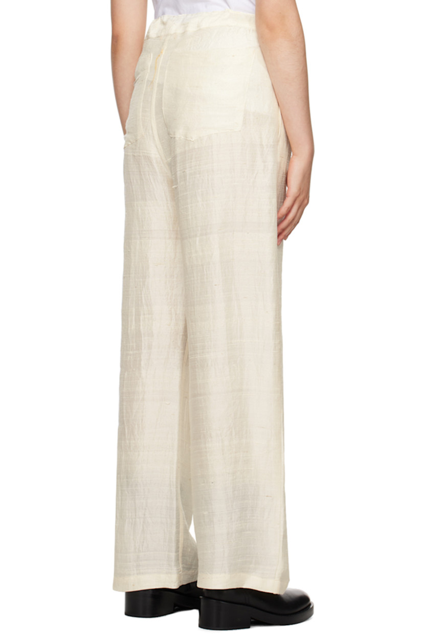 Silk khadi trousers.

· Self-tie drawstring at waistband
· Four-pocket styling
· Button-fly
· Logo embroidered at back
· Unlined

Supplier color: Natural