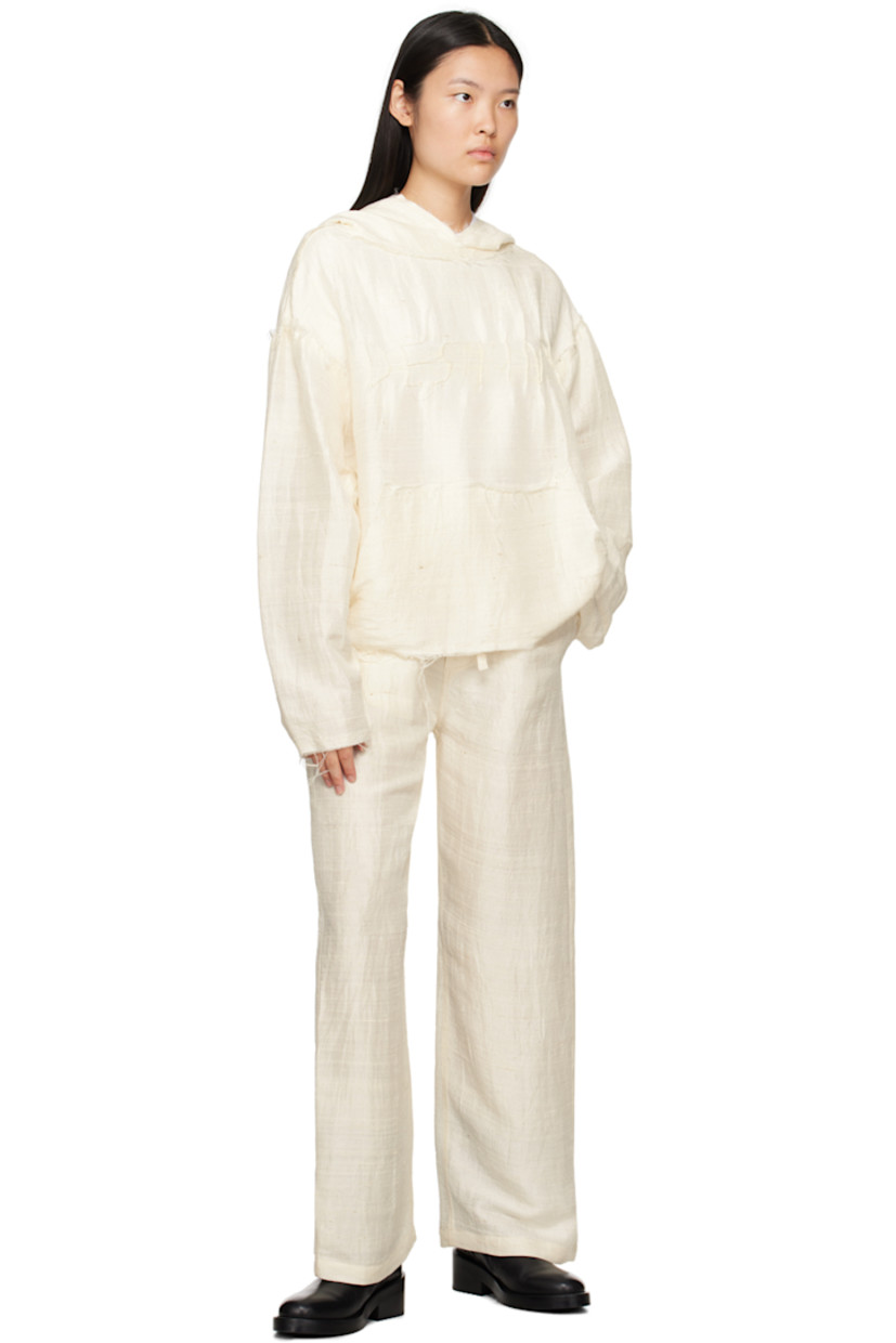 Silk khadi trousers.

· Self-tie drawstring at waistband
· Four-pocket styling
· Button-fly
· Logo embroidered at back
· Unlined

Supplier color: Natural