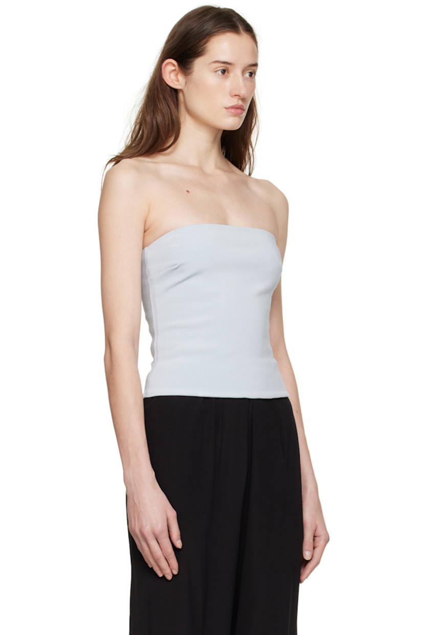Stretch rib knit FSC-certified viscose tank top. 

· Straight neck
· Darts at front
· Zip closure at back

Supplier colour: Celestine