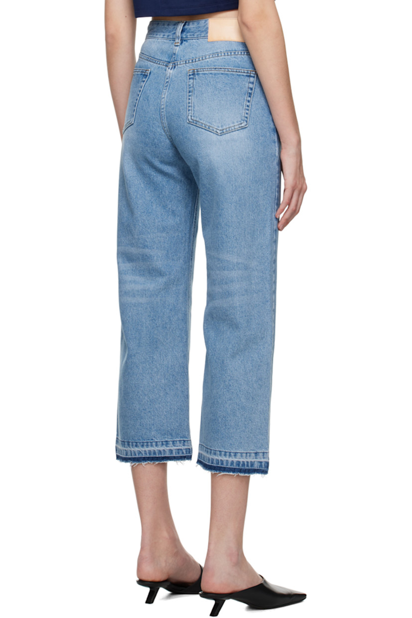 Non-stretch denim jeans. Fading and whiskering throughout.

· Belt loops
· Five-pocket styling
· Zip-fly
· Raw edge at cuffs
· Leather logo patch at back waistband
· Logo-engraved silver-tone hardware
· Contrast stitching in tan

Supplier color: Smoke blue