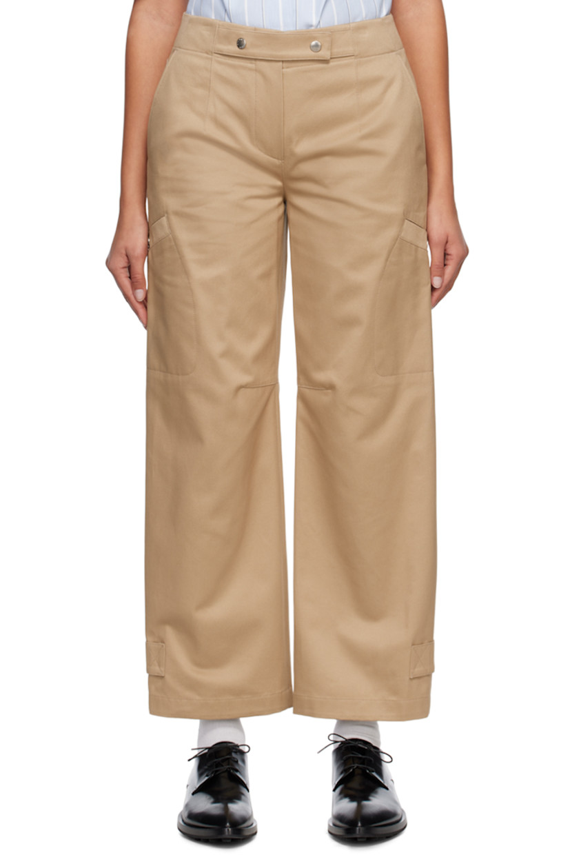 Cotton twill trousers. 

· Press-stud fastenings at waistband 
· Three-pocket styling 
· Zip-fly 
· Darts at front 
· Patch pocket at outseams 
· Adjustable press-stud tab at cuffs 
· Logo-engraved silver-tone hardware 

Supplier color: Beige