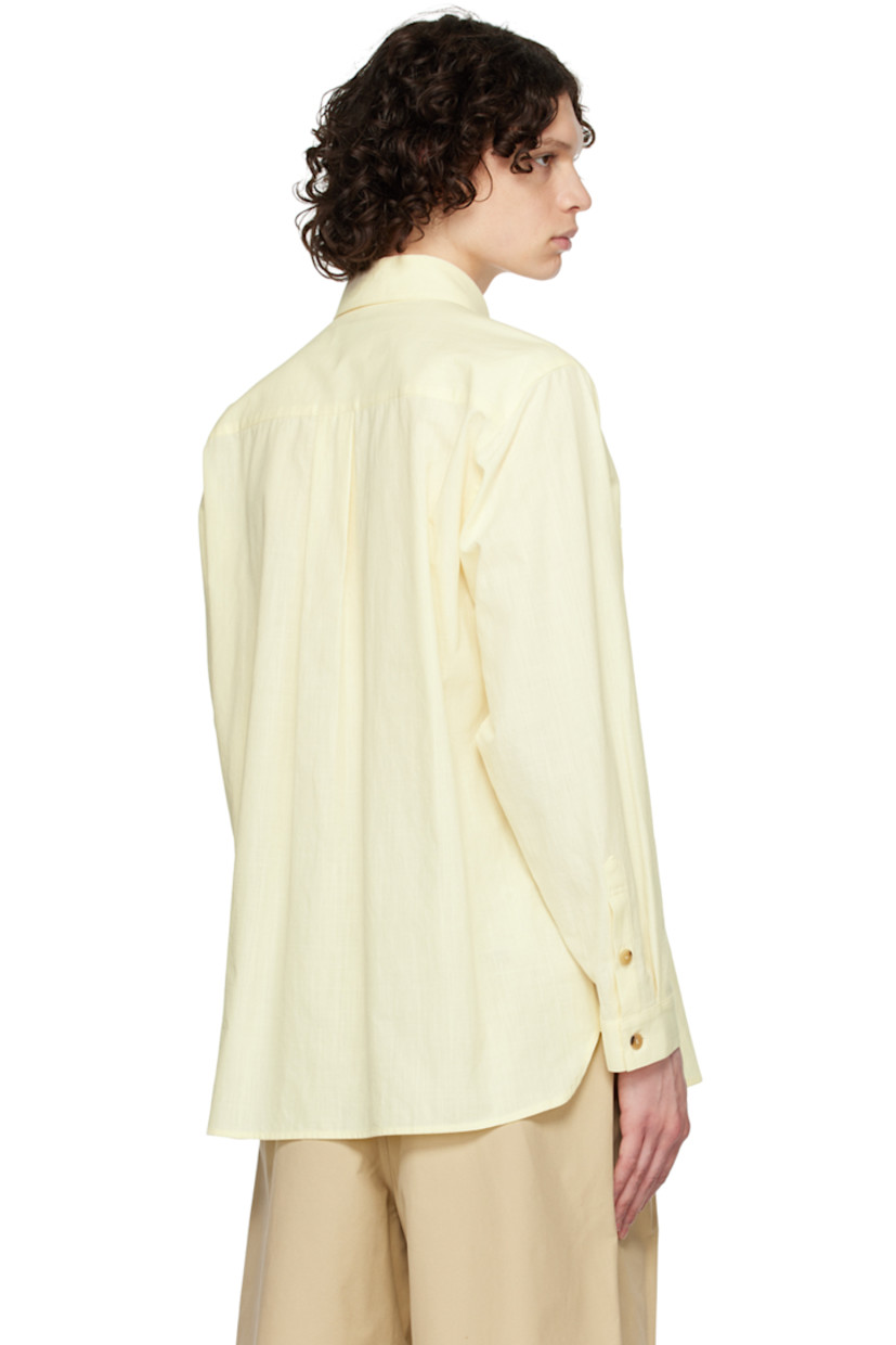 Plain-woven slub cotton shirt.

· Layered construction
· Spread collar
· Button closure
· Patch pocket
· Shirttail hem
· Single-button barrel cuffs
· Logo-engraved horn hardware

Supplier color: Yellow