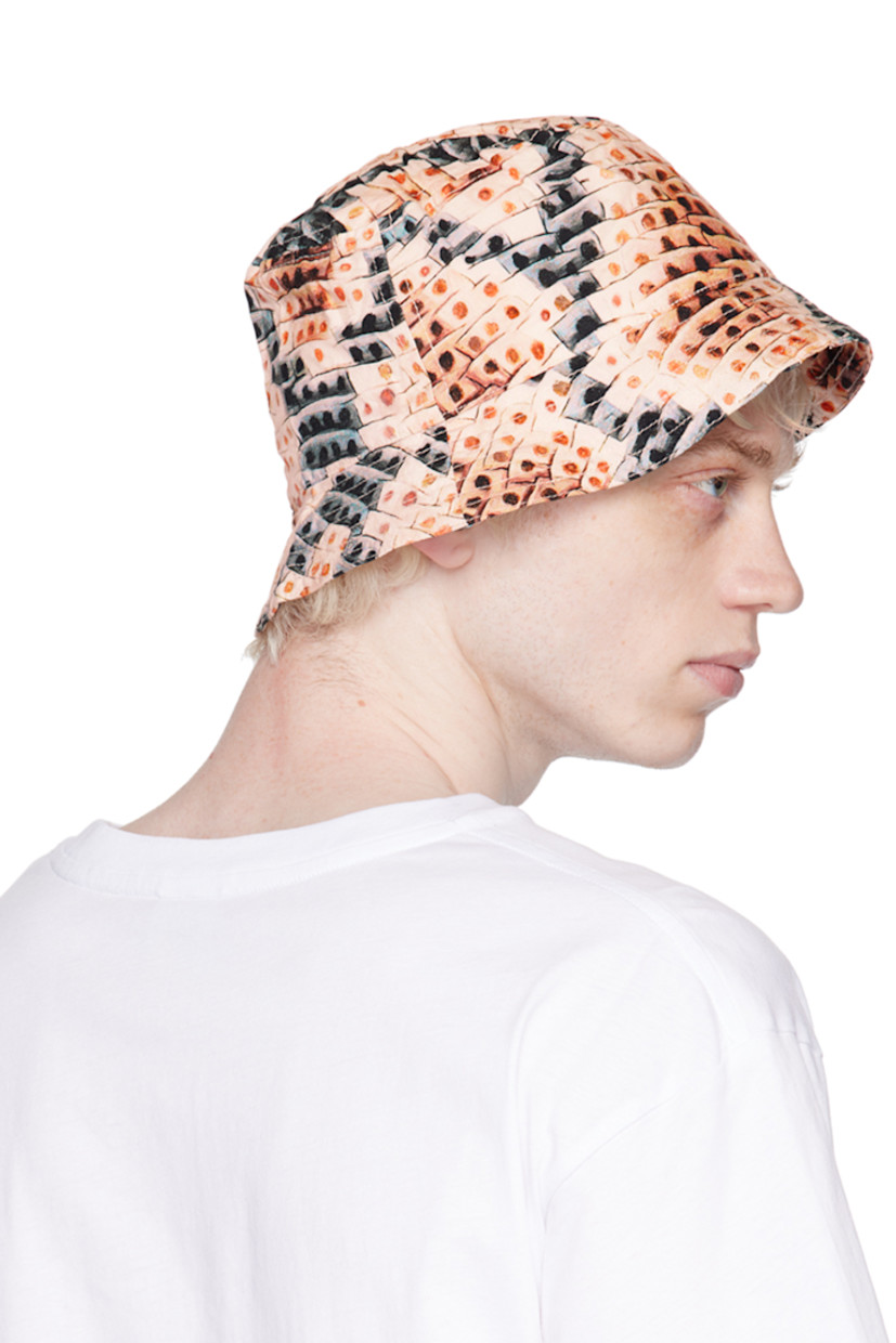 Plain-woven tencel bucket hat in beige. Snake pattern printed throughout.

· Quilted brim
· Logo patch at interior

Supplier color: Tan