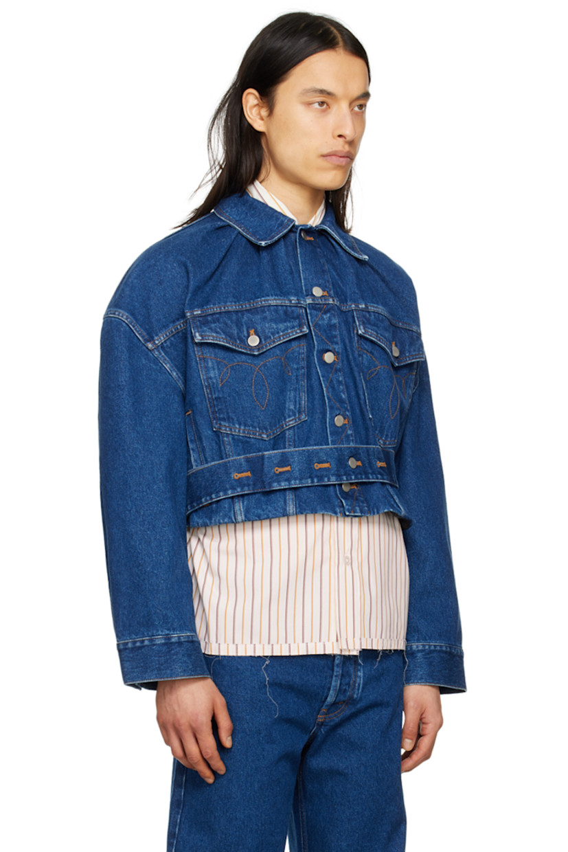 Non-stretch denim jacket. Fading throughout.

· Paneled construction
· Spread collar
· Button closure
· Graphic pattern embroidered at chest
· Flap pockets and welt pockets
· Detachable self-tie belt at cropped hem
· Dropped shoulders
· Single-button barrel cuffs
· Gathering at back collar
· Locker loop at back yoke
· Patent leather logo patches at back hem

Supplier color: Blue