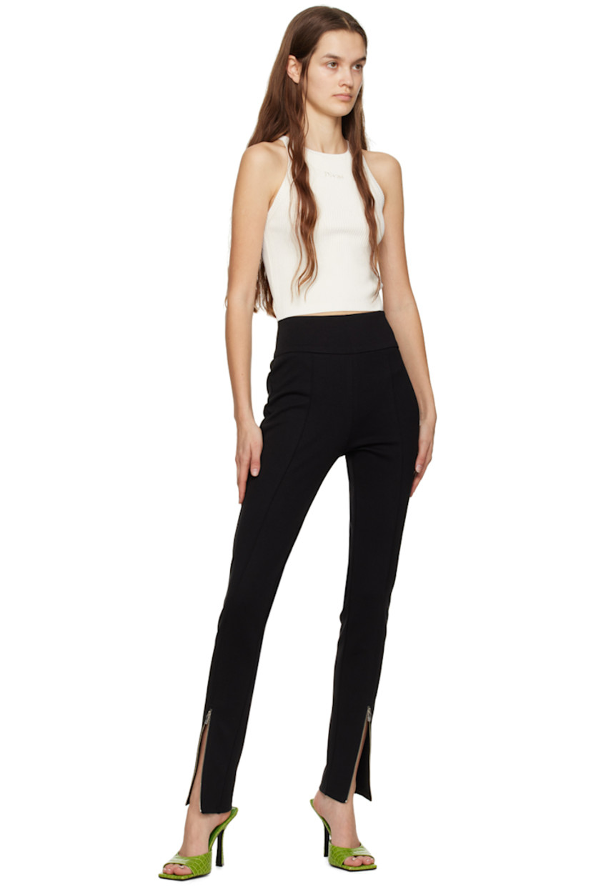 Double-faced stretch polyester and rayon-blend jersey trousers.

· Elasticized waistband
· Pinched seams
· Central zip vent at cuffs
· Zip closure at outseam

Supplier color: Black