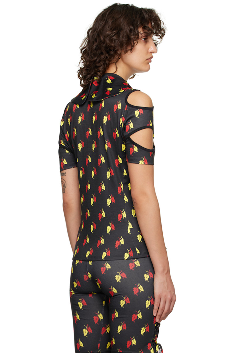 Stretch polyester jersey and organic cotton poplin polo. Graphic pattern printed throughout.

· Modified Peter Pan collar
· Graphic hardware at three-button placket
· Cutouts at sleeves
· Rib knit cuffs
· Logo-engraved silver-tone hardware

Supplier color: Black/Multi