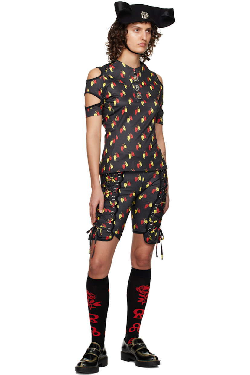 Stretch polyester jersey and organic cotton poplin polo. Graphic pattern printed throughout.

· Modified Peter Pan collar
· Graphic hardware at three-button placket
· Cutouts at sleeves
· Rib knit cuffs
· Logo-engraved silver-tone hardware

Supplier color: Black/Multi
