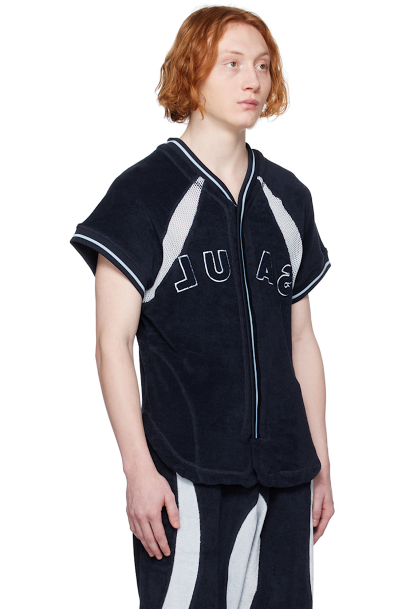 Cotton-blend terrycloth shirt. Mesh trim throughout.

· Paneled construction 
· Rib knit V-neck and cuffs
· Zip closure
· Logo embroidered at front
· Shirttail hem

Supplier color: Navy