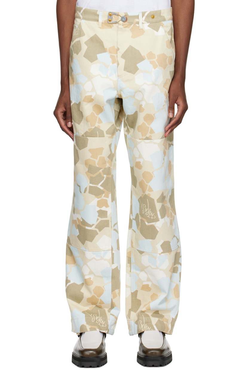Loose-fit garment-dyed non-stretch deadstock cotton denim jeans. Camouflage pattern and text printed throughout.

· Belt loops
· Five-pocket styling
· Zip-fly
· Hand-stamped logo at hammer loop and back pocket
· Patch pockets at outseam

Supplier color: Blue camo