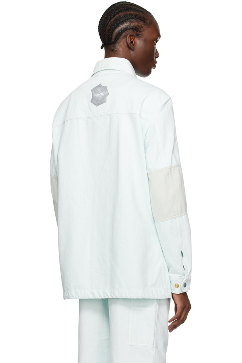 Non-stretch deadstock cotton denim shirt. Deadstock cotton- and linen-blend canvas panels throughout.

· Spread collar
· Press-stud closure
· Zip pocket and patch pocket at chest
· Text stamped at chest pocket
· Welt pockets
· Adjustable press-stud barrel cuffs
· Logo stamp at back

Supplier color: Ice blue