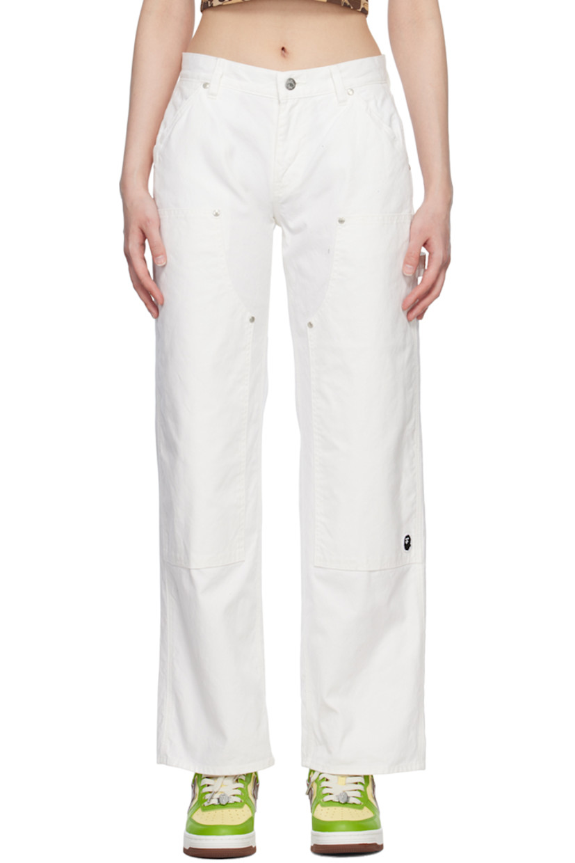 Wide-leg cotton canvas trousers. Logo-engraved rivet detailing throughout. 

· Low-rise 
· Belt loops
· Four-pocket styling
· Zip-fly
· Embroidered logo patch at leg 
· Textile logo patch at back 

Supplier color: White