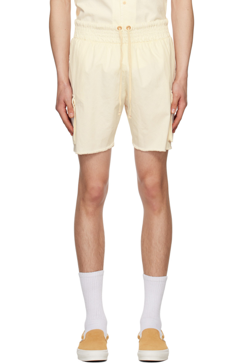 Cotton twill shorts.

· Drawstring at elasticized waistband
· Three-pocket styling
· Cargo pocket at outseams
· Raw edge at cuffs

Supplier color: Ivory stone