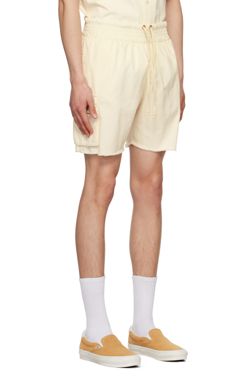 Cotton twill shorts.

· Drawstring at elasticized waistband
· Three-pocket styling
· Cargo pocket at outseams
· Raw edge at cuffs

Supplier color: Ivory stone