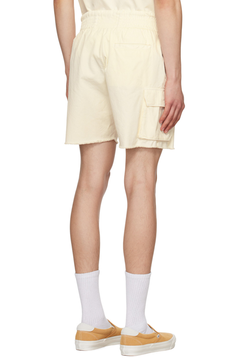 Cotton twill shorts.

· Drawstring at elasticized waistband
· Three-pocket styling
· Cargo pocket at outseams
· Raw edge at cuffs

Supplier color: Ivory stone