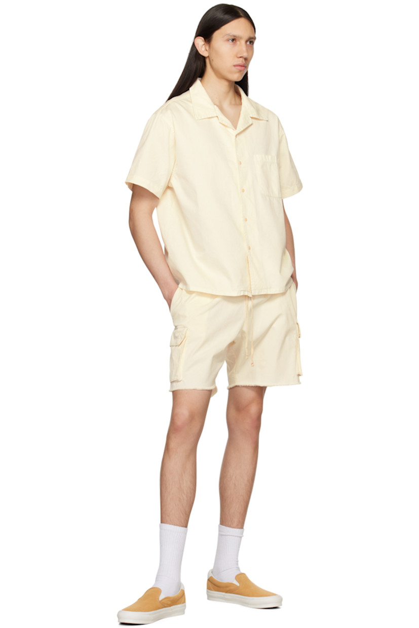 Cotton twill shorts.

· Drawstring at elasticized waistband
· Three-pocket styling
· Cargo pocket at outseams
· Raw edge at cuffs

Supplier color: Ivory stone