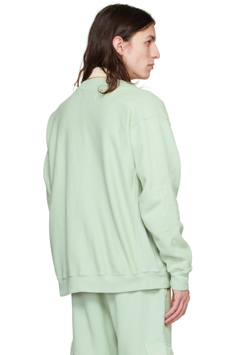 Garment-dyed organic cotton French terry cardigan.

· Y-neck
· Button closure
· Rib knit hem and cuffs
· Corozo hardware

Supplier color: Mint chip