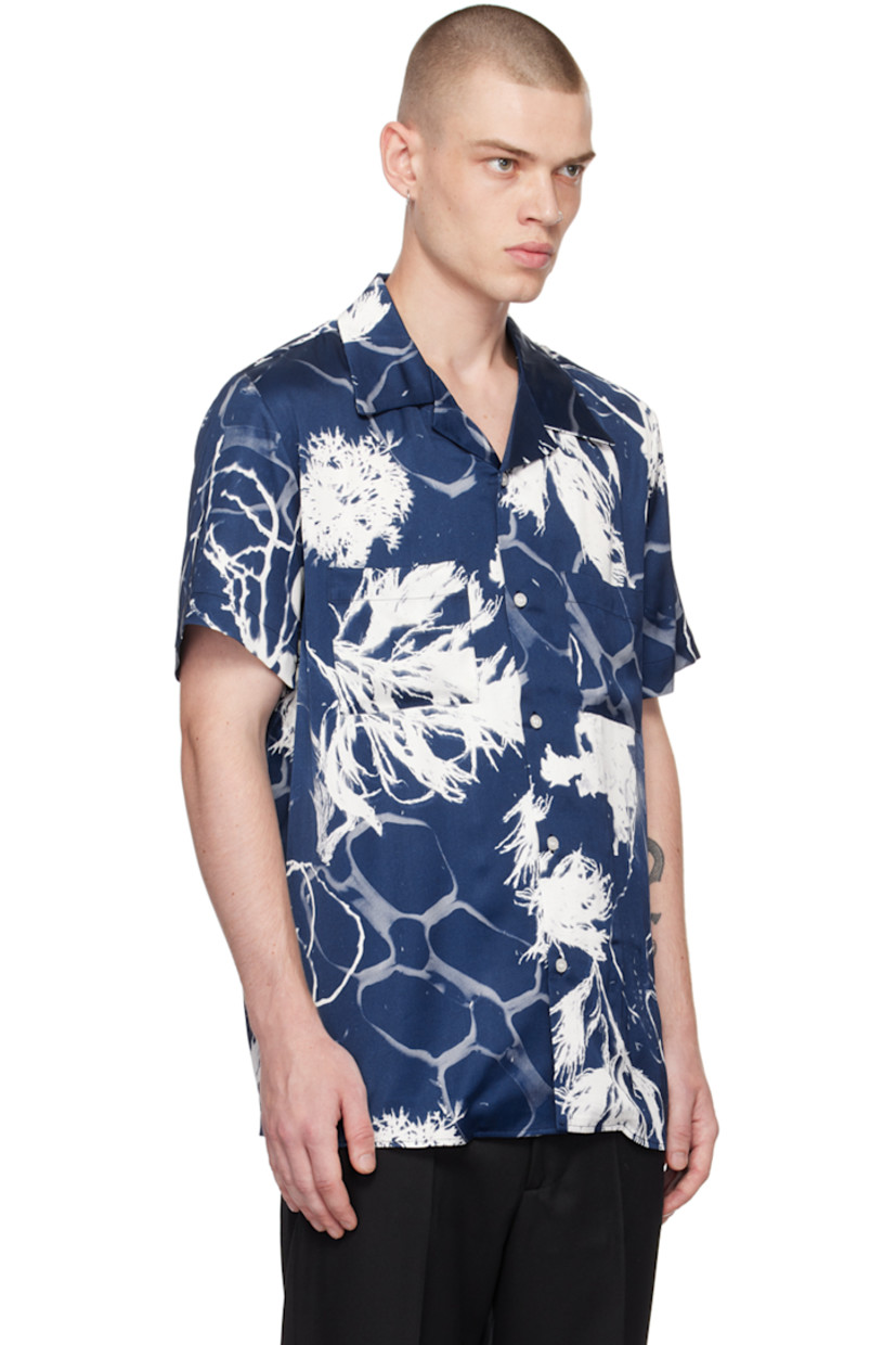 Viscose satin shirt. Graphic pattern printed throughout. 

· Open spread collar 
· Button closure 
· Patch pockets 
· Box pleat at back 

Supplier color: Print