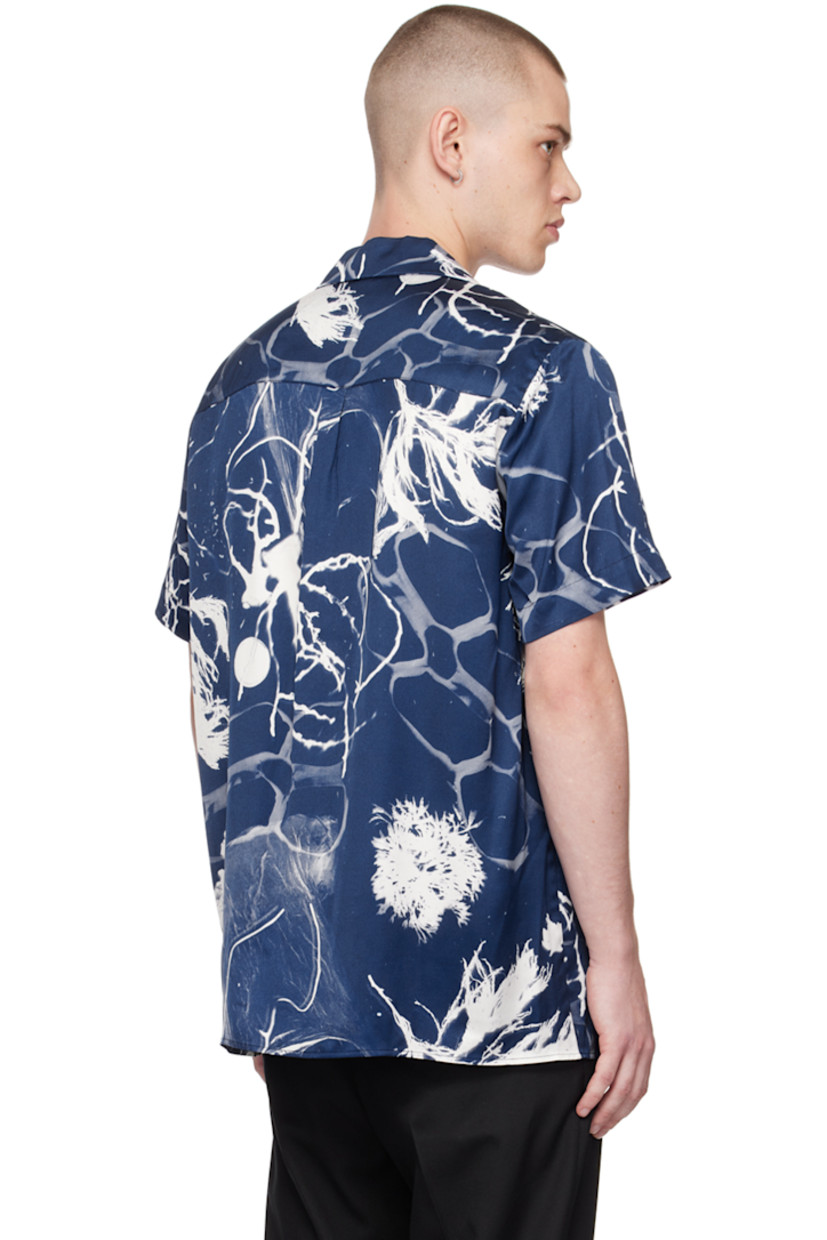 Viscose satin shirt. Graphic pattern printed throughout. 

· Open spread collar 
· Button closure 
· Patch pockets 
· Box pleat at back 

Supplier color: Print