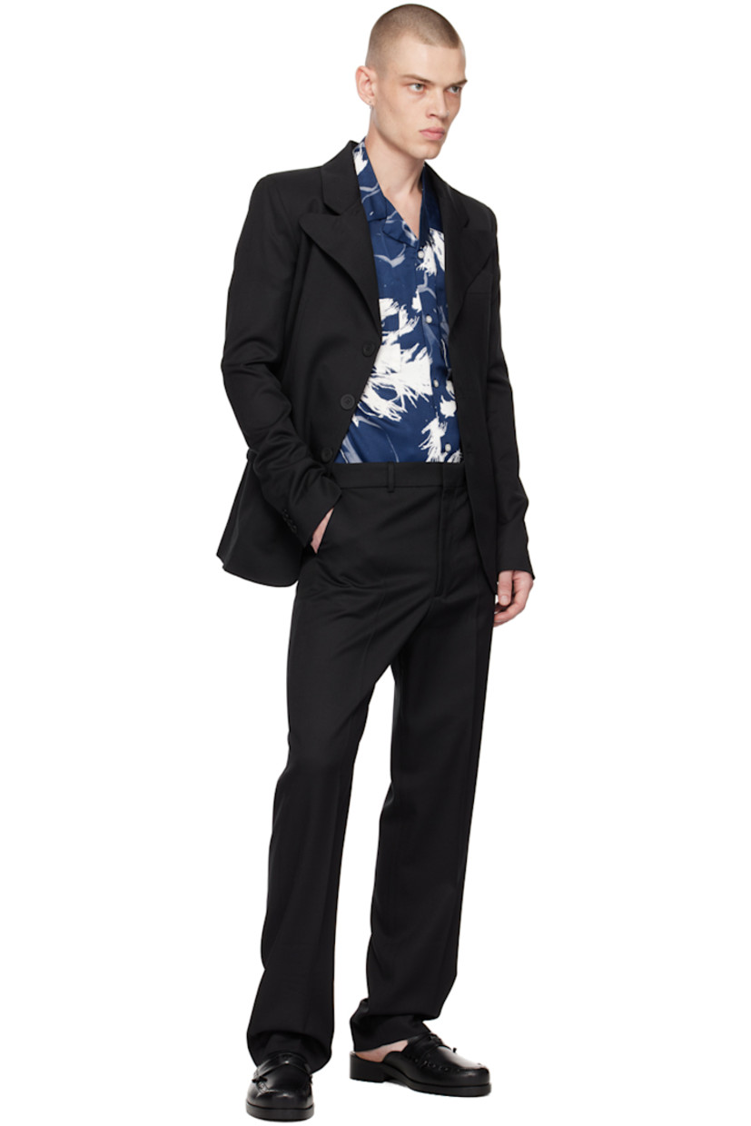 Viscose satin shirt. Graphic pattern printed throughout. 

· Open spread collar 
· Button closure 
· Patch pockets 
· Box pleat at back 

Supplier color: Print