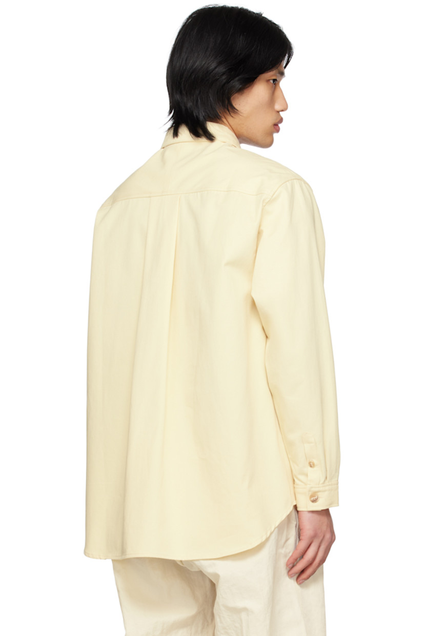 OEKO-TEX®-certified cotton twill shirt. 

· Spread collar
· Button closure 
· Patch pockets 
· Shirttail hem 
· Single-button barrel cuffs
· Box pleat at back yoke 
· Corozo hardware

Supplier color: Ecru