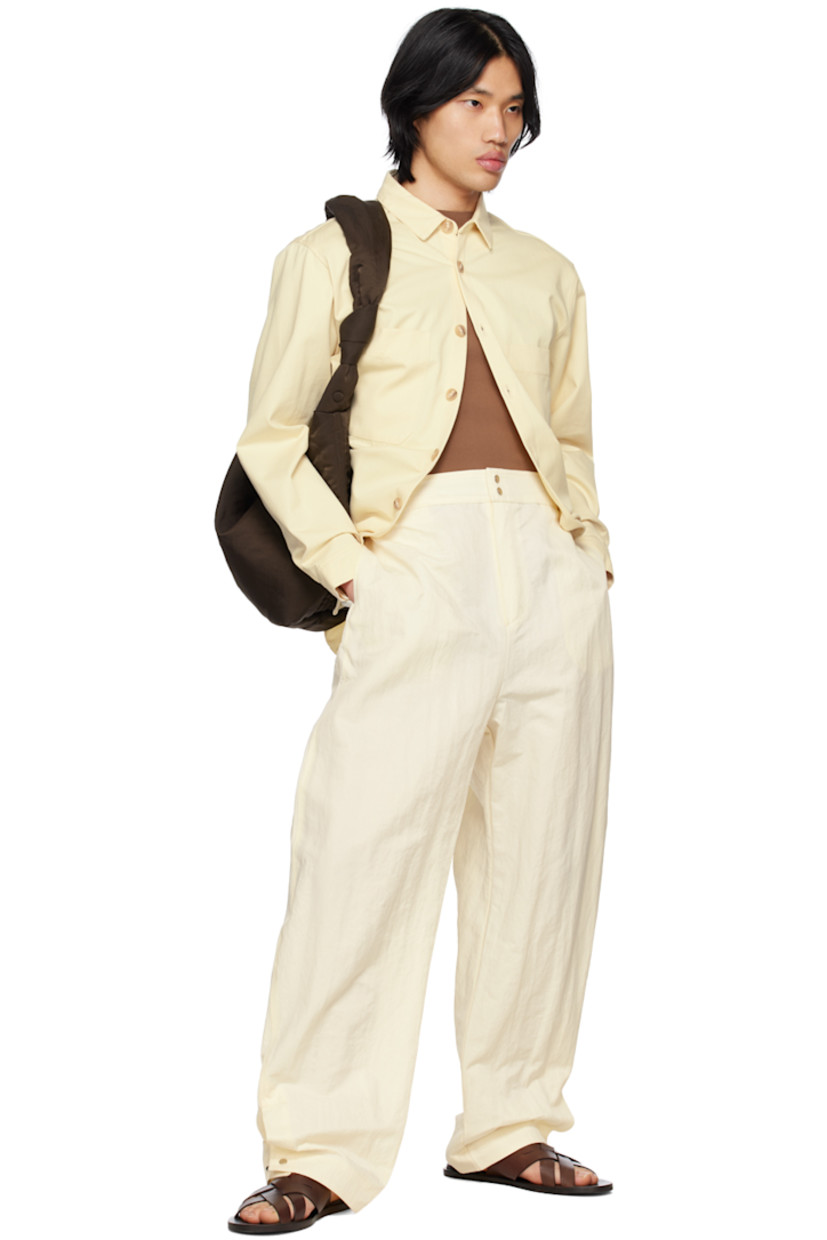 OEKO-TEX®-certified cotton twill shirt. 

· Spread collar
· Button closure 
· Patch pockets 
· Shirttail hem 
· Single-button barrel cuffs
· Box pleat at back yoke 
· Corozo hardware

Supplier color: Ecru