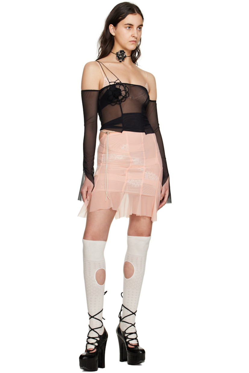 Sheer polyester mesh T-shirt. Pleats throughout.

· Off-the-shoulder construction
· Lace detailing at straight neck
· Embroidered floral detailing at front
· Raw edge at hem and vented cuffs
· Adjustable shoulder strap

Available exclusively at SSENSE.

Supplier color: Black