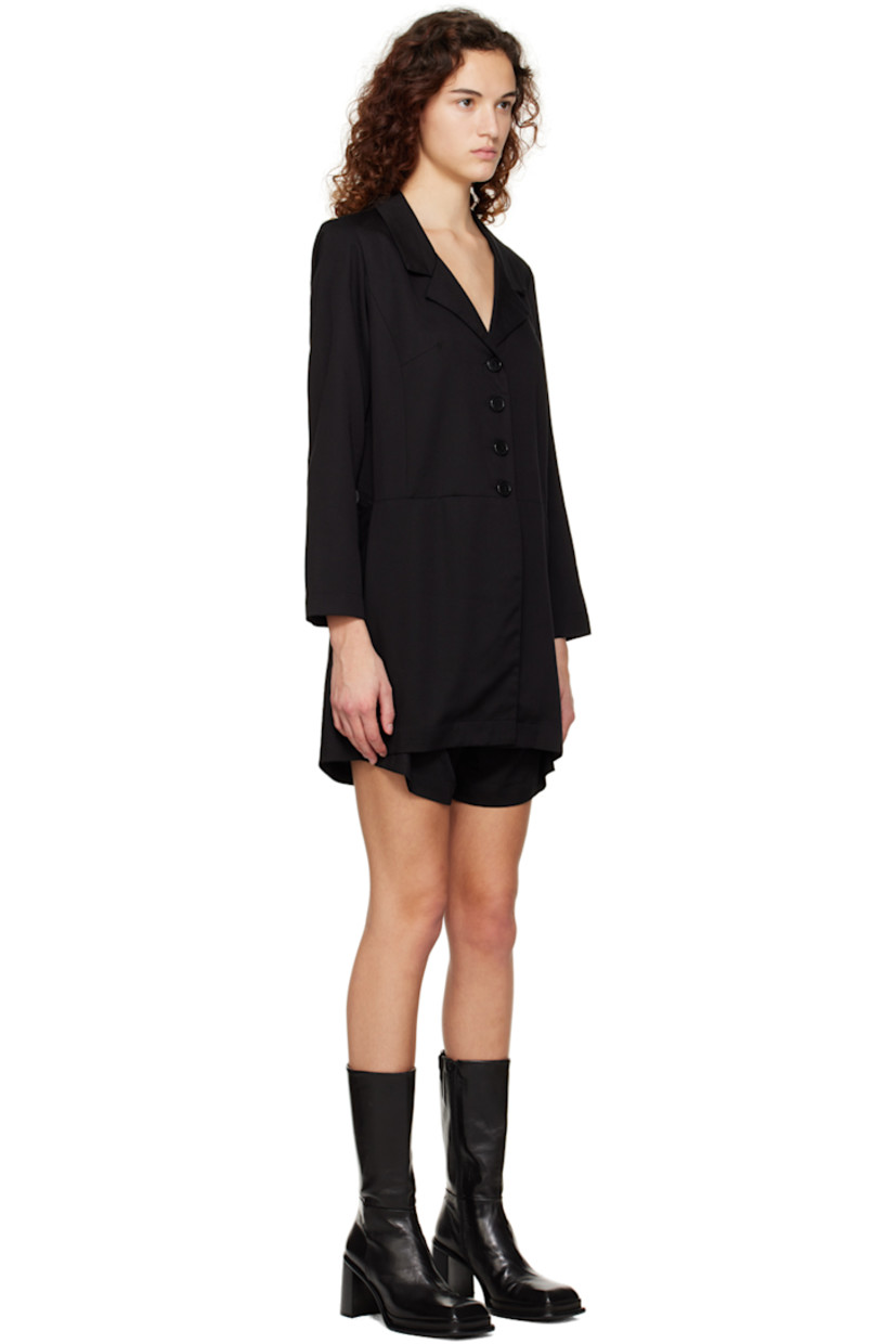PEFC™ and FSC®-certified Tencel™ lyocell twill jumpsuit. 

· Layered construction
· Notched lapel collar
· Button closure
· Zip-fly
· Cutouts at back

Supplier color: Black