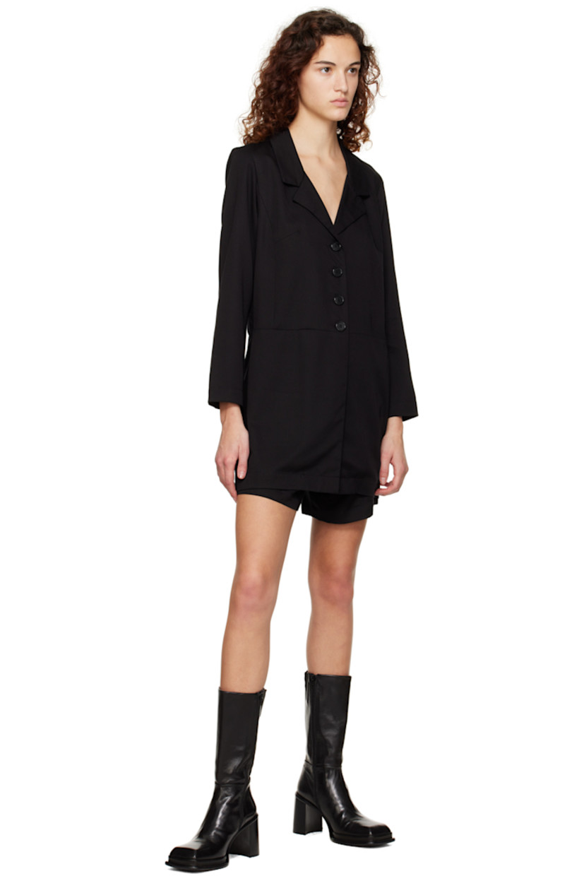 PEFC™ and FSC®-certified Tencel™ lyocell twill jumpsuit. 

· Layered construction
· Notched lapel collar
· Button closure
· Zip-fly
· Cutouts at back

Supplier color: Black